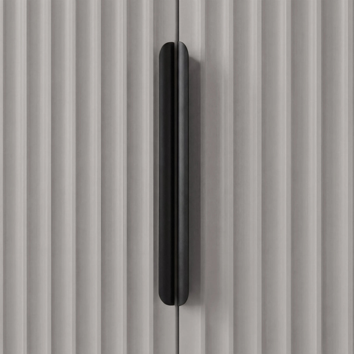 Grey wardrobe with black handle, close up mounted vertically on textured flutrina two door panel