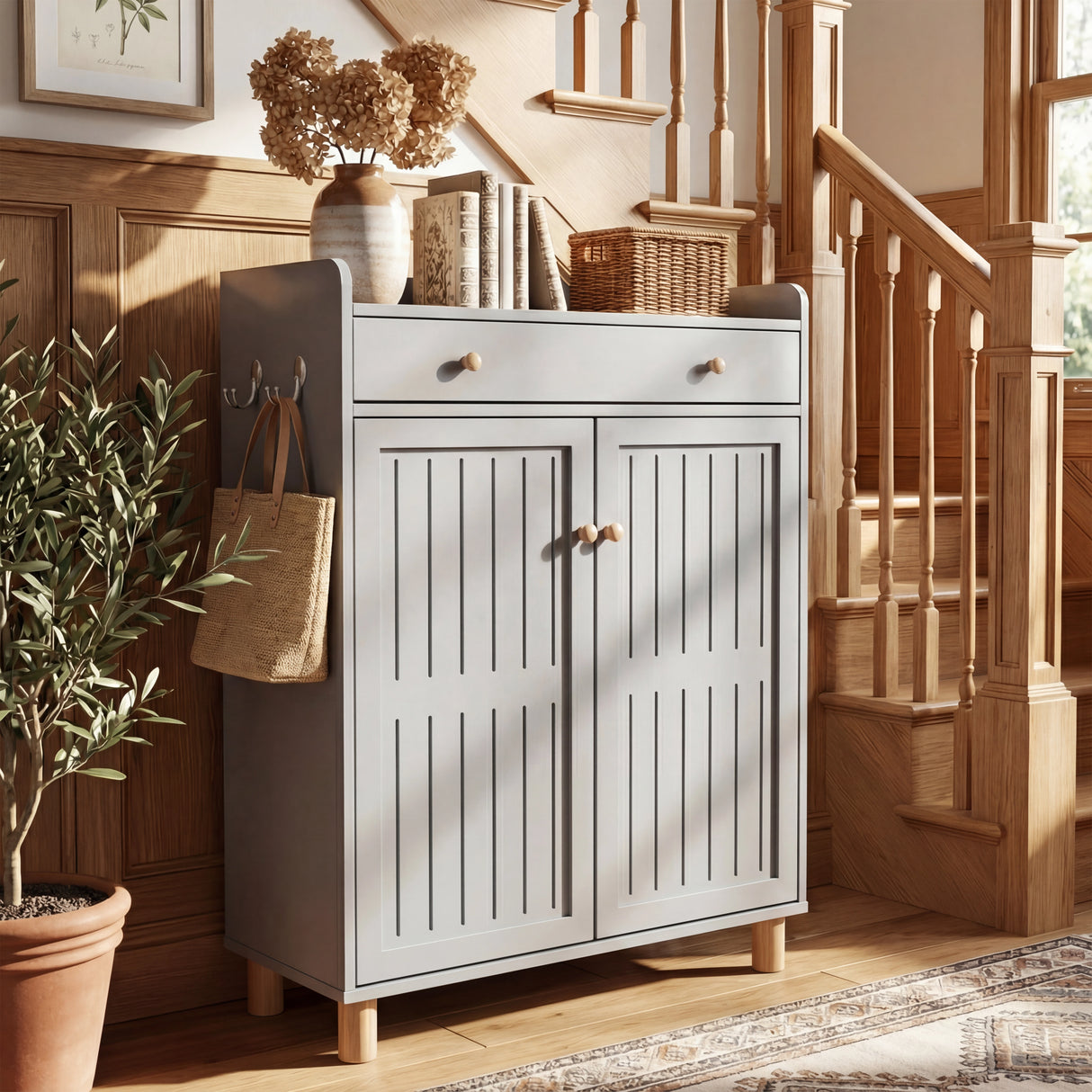 Compact grey shoe storage unit with slatted door design placed against a wall with bright light
