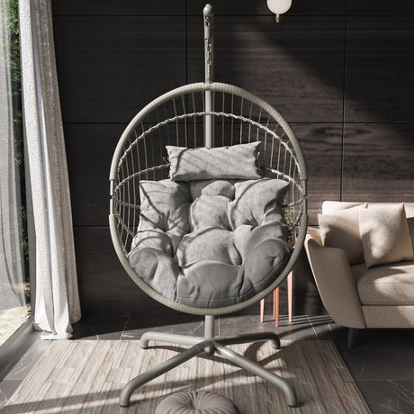 Grey hanging egg chair with plush cushions and sturdy stand, perfect for modern interiors.