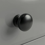 [Grey] Haven chest detail showing a matte black rounded drawer knob set against the smooth light grey painted drawer front