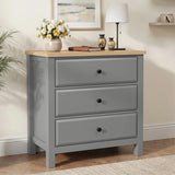 [Grey] Haven front room view with three drawers, oak-effect top, black knobs, framed art, and lamp