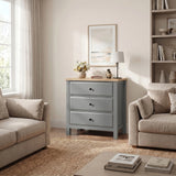 [Grey] Haven lifestyle room view with three drawers, oak-effect top, sofas, window, wall art, and shelving