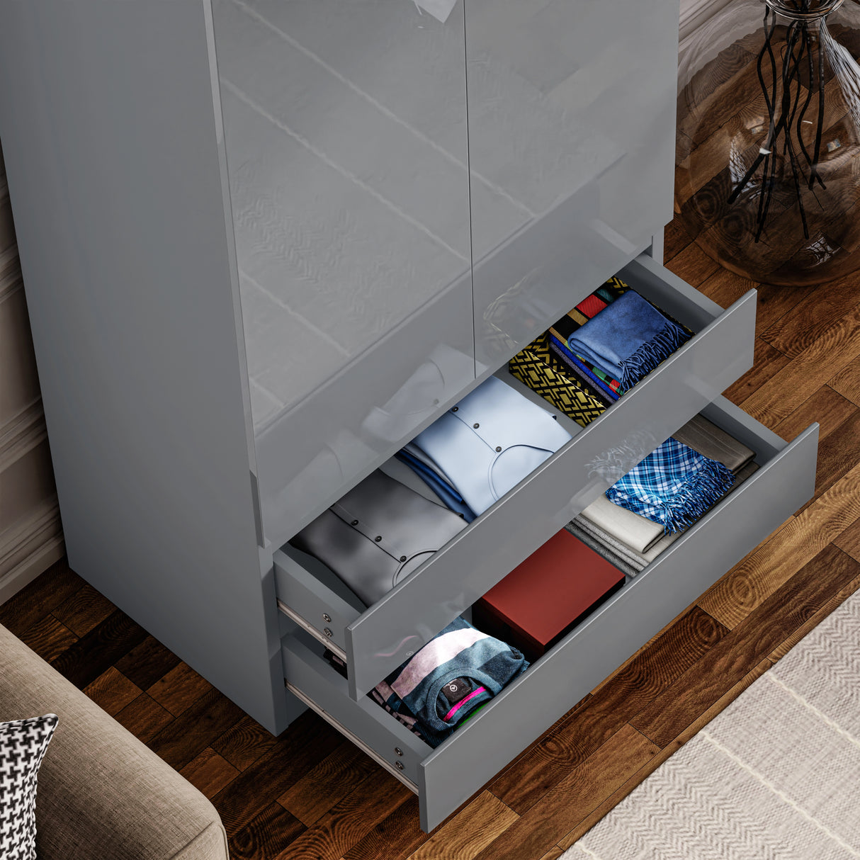 Open drawers of grey high gloss wardrobe showcasing folded clothes. Functional and elegant storage for modern bedroom furnishings.