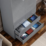 Open drawers of grey high gloss wardrobe showcasing folded clothes. Functional and elegant storage for modern bedroom furnishings.