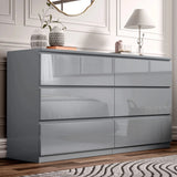 [Grey] High gloss 6 drawer chest styled in bedroom with mirror lamp and decorative accents.