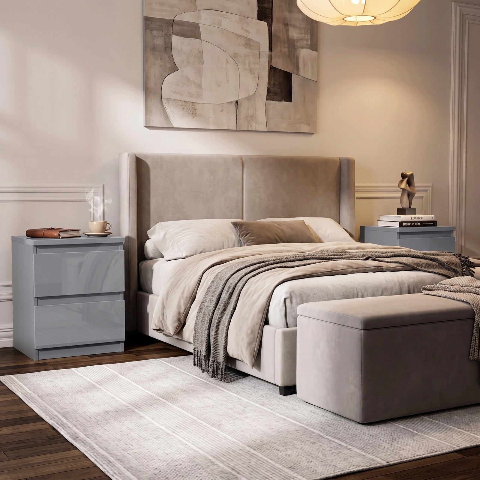 [Grey] A modern bedroom featuring a bed with a tall upholstered headboard, beige bedding, a matching ottoman in a neutral-toned room.