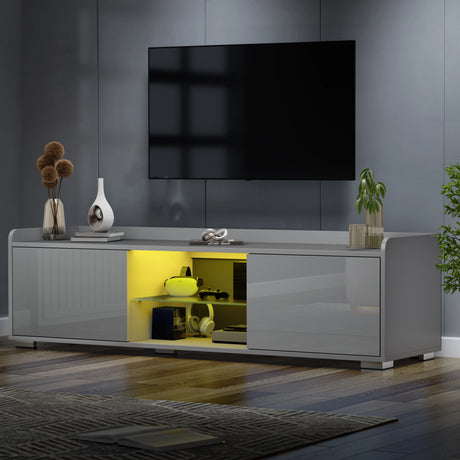 Modern living room with a gray TV stand, television, and decorative items.