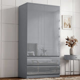[Grey] High gloss wardrobe angled view with closed doors, lower drawers, reflective panels, side table, wall art, and vase.