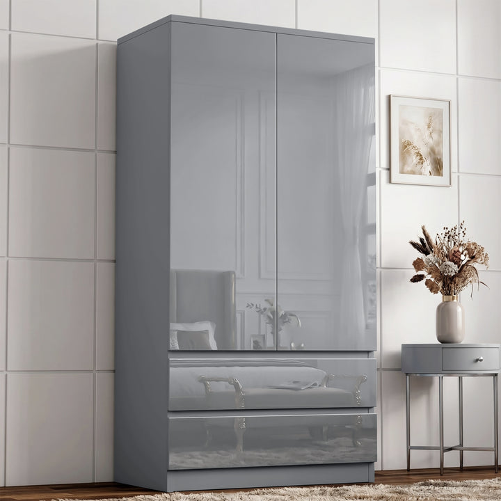 [Grey] High gloss wardrobe angled view with closed doors, lower drawers, reflective panels, side table, wall art, and vase.