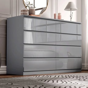 [Grey] high gloss wide chest of drawers in bedroom corner with lamp glowing and candles on top