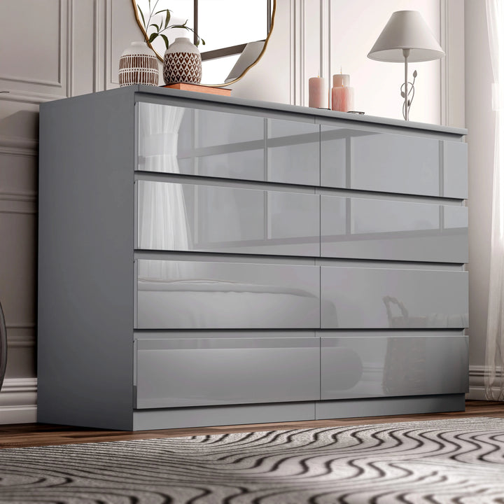 [Grey] high gloss wide chest of drawers in bedroom corner with lamp glowing and candles on top