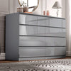 [grey] high gloss 8 drawer chest styled in bedroom with lamp and gold-framed mirror on wall