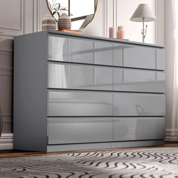 [Grey] high gloss wide chest of drawers in bedroom corner with lamp glowing and candles on top