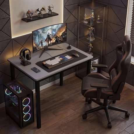 [80 X 50 cm] Home Office Desk styled as immersive gaming setup with curved monitor, RGB keyboard, headphones, gaming chair, and ambient lighting