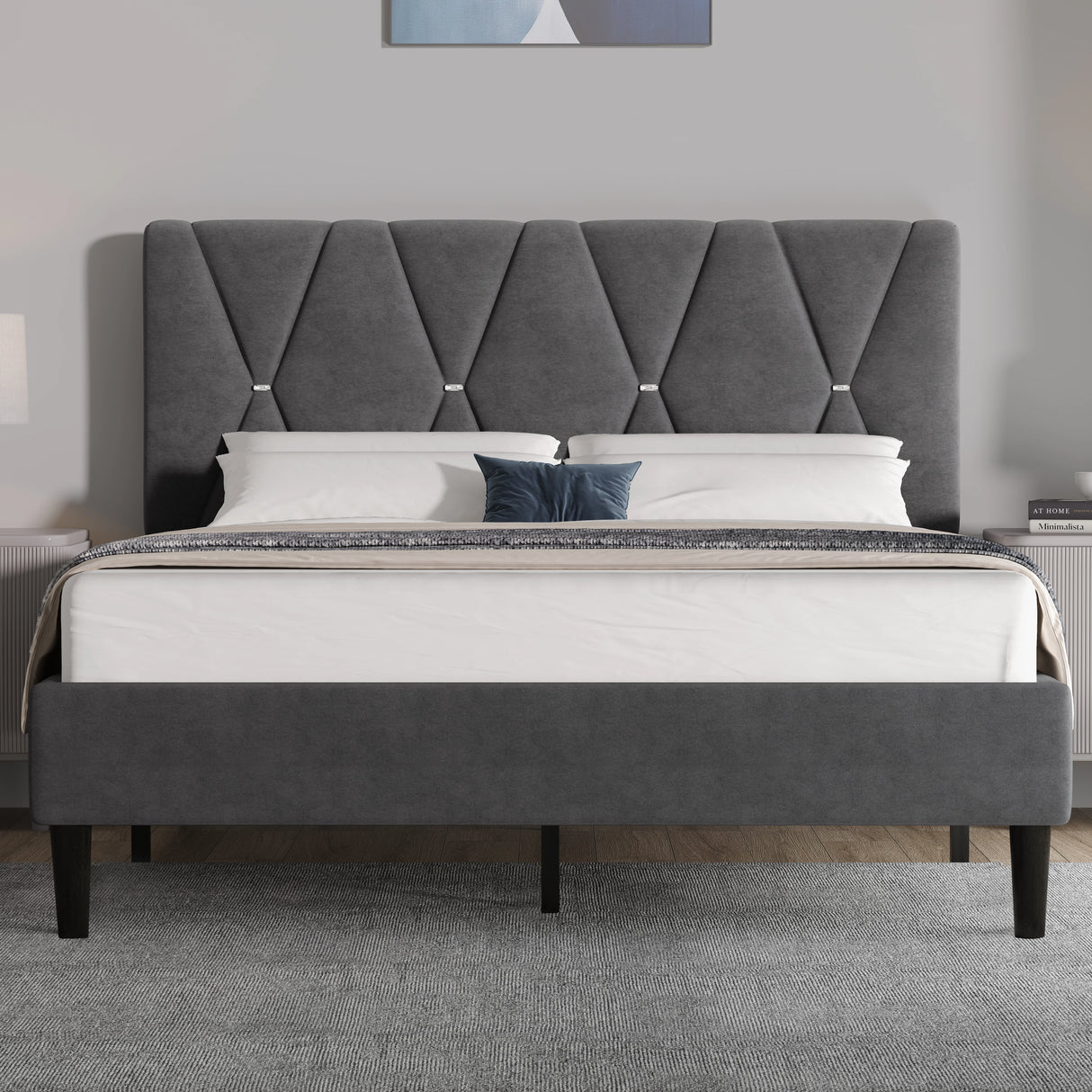 Gray upholstered bed with tufted headboard in a bedroom setting