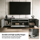 [Grey] Kystra TV unit feature image, side cabinets open showing storage, chrome soft-close hinge inset detail