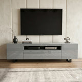 [Grey] Kystra TV stand front-on against a tall padded vertical-panel wall, thin black legs on a pale rug