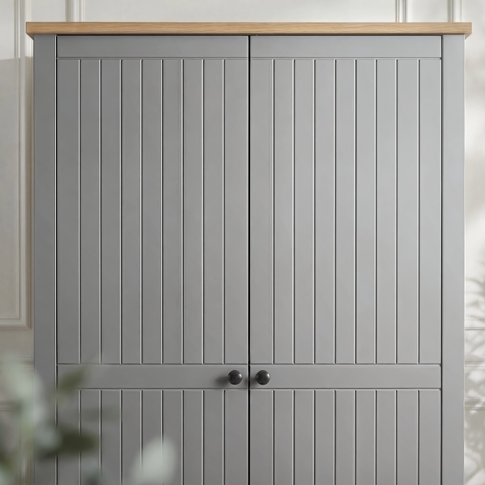 [Grey] Linra 2 door wardrobe upper close-up, oak effect top, vertical grooved doors, black knobs at meet