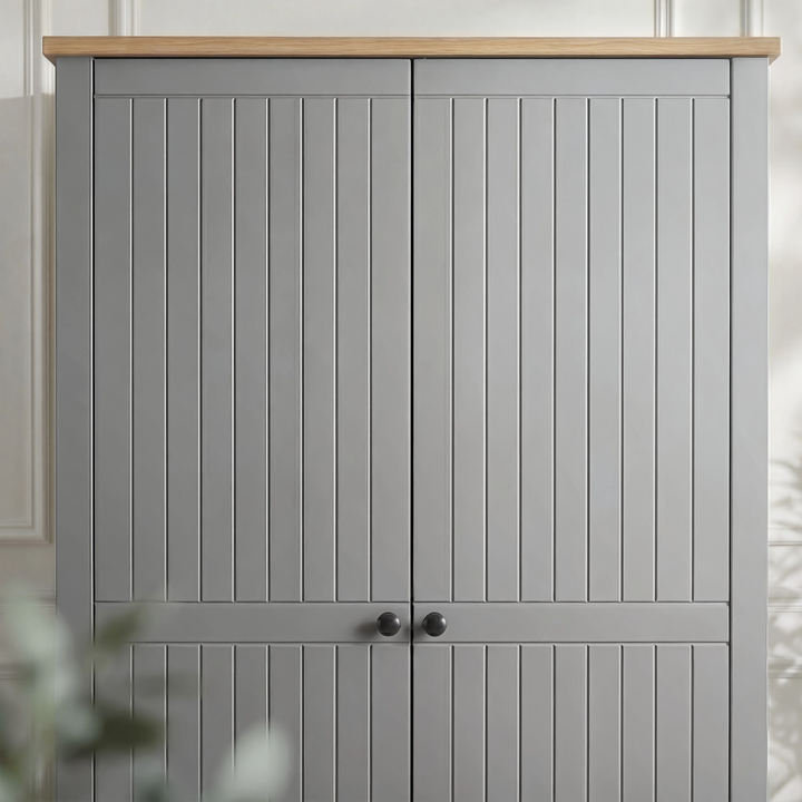 [Grey] Linra 2 door wardrobe upper close-up, oak effect top, vertical grooved doors, black knobs at meet