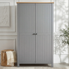 [Grey] Linra 2 door wardrobe front view, white panelled room, woven basket with throw, olive tree on right