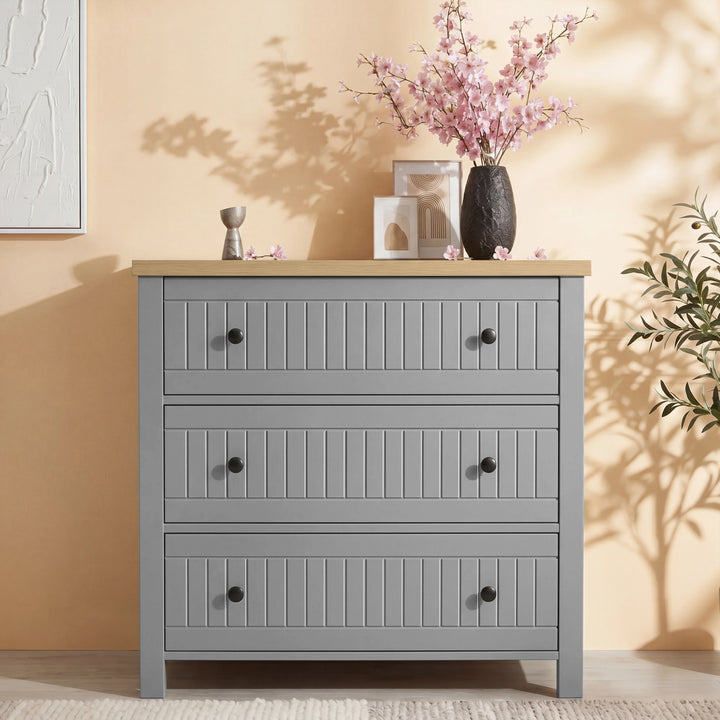 [Grey] Chest of drawers from Linra bedroom furniture set styled with vase and round mirror on panelled wall