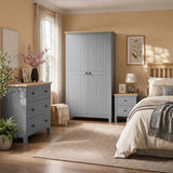 [Grey] Linra bedroom furniture set styled in panelled bedroom with grey wardrobe, 3 drawer chest and bedside