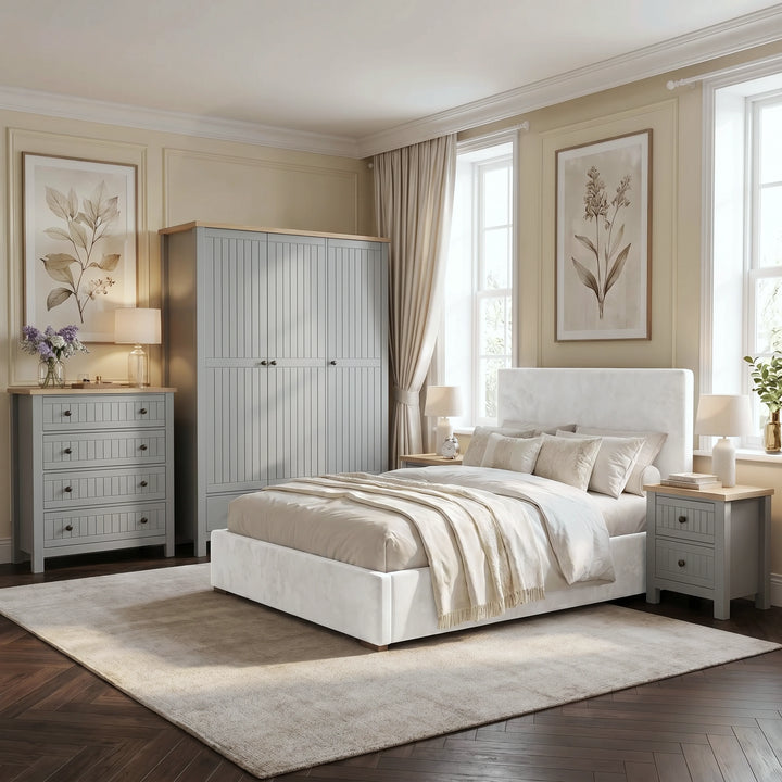 [Grey] Linra Painted 4 Piece Bedroom Furniture Set Grey styled in an elegant bedroom with a white upholstered bed, botanical prints, tall windows, and cream linen bedding