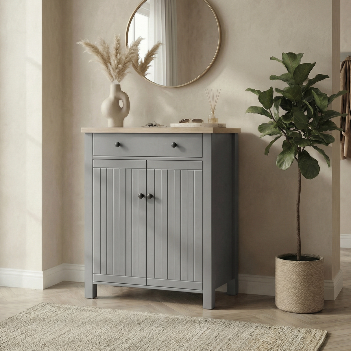 [Grey] Linra shoe cabinet with grooved double doors, oak top, black knobs, and top drawer styled beside a fiddle leaf plant