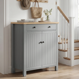 [Grey] Linra Grey 4 Tier Painted Shoe Storage Cabinet With Drawer closed front view in staircase hallway with flowers and stacked books on oak top surface