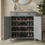 [Grey] Linra shoe cabinet fully open showing four shelves filled with oxfords, loafers, and heels in a warm hallway setting