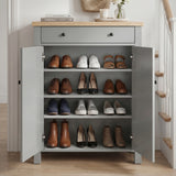 [Grey] Linra Grey 4 Tier Painted Shoe Storage Cabinet With Drawer three-quarter view in styled hallway with staircase, coat hooks and flowers on oak top