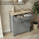 [Grey] Linra shoe cabinet with top drawer pulled open holding headphones, sunglasses, and watch in a warm hallway setting