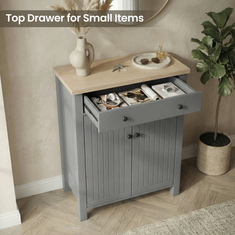 [Grey] Linra shoe cabinet with top drawer pulled open holding headphones, sunglasses, and watch in a warm hallway setting