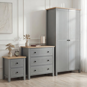[Grey] Linra bedroom furniture set styled in panelled bedroom with grey wardrobe, 3 drawer chest and bedside