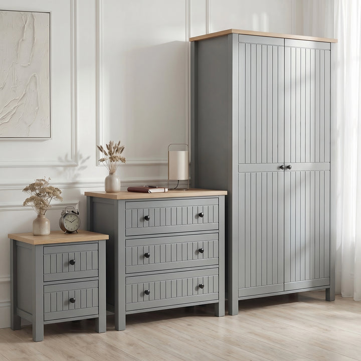 [Grey] Linra bedroom furniture set styled in panelled bedroom with grey wardrobe, 3 drawer chest and bedside
