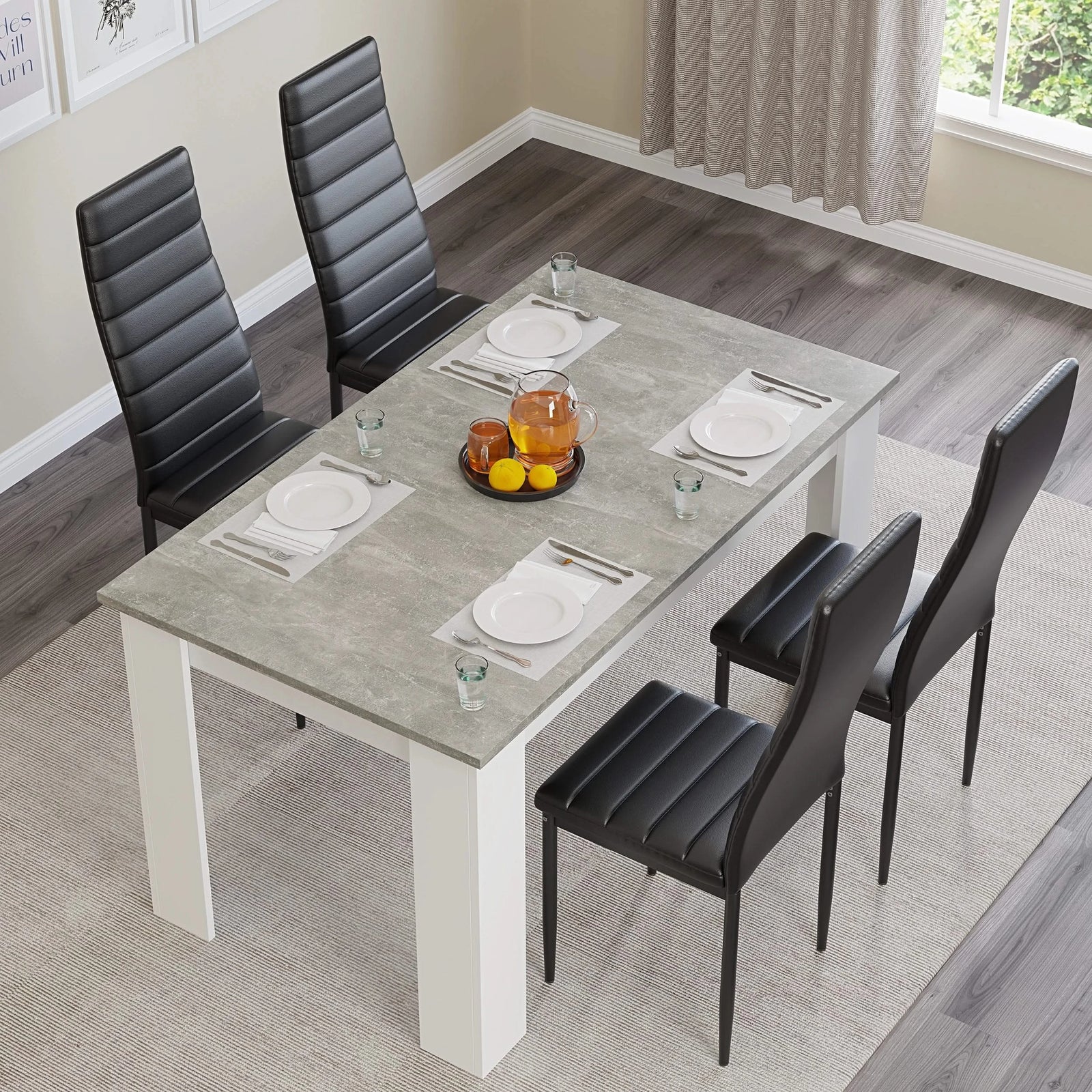 [4 Seater | Black] Top-angled: grey marble 4 seater table, 4 black chairs, plates, orange bowl