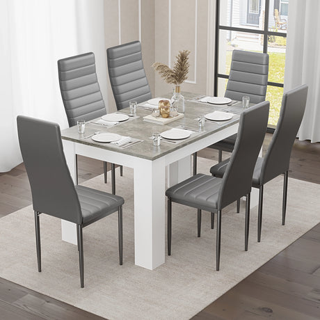 elegant 6 seater dining table and chairs set in grey marble with soft grey seats, styled for a modern dining room