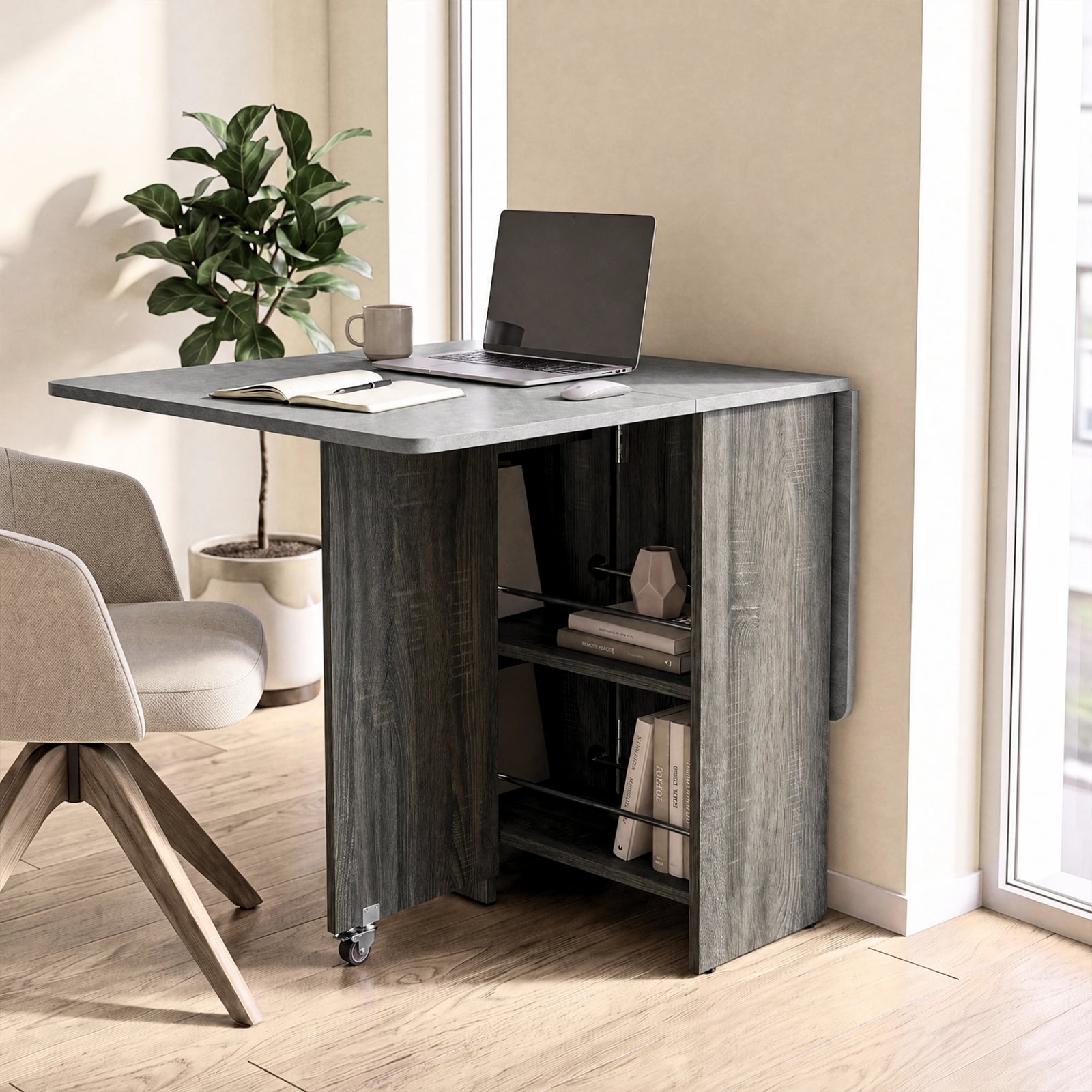 [Grey] Compact folding dining table used as a desk, with one marble-effect leaf raised and rod-fronted shelves on wheels.