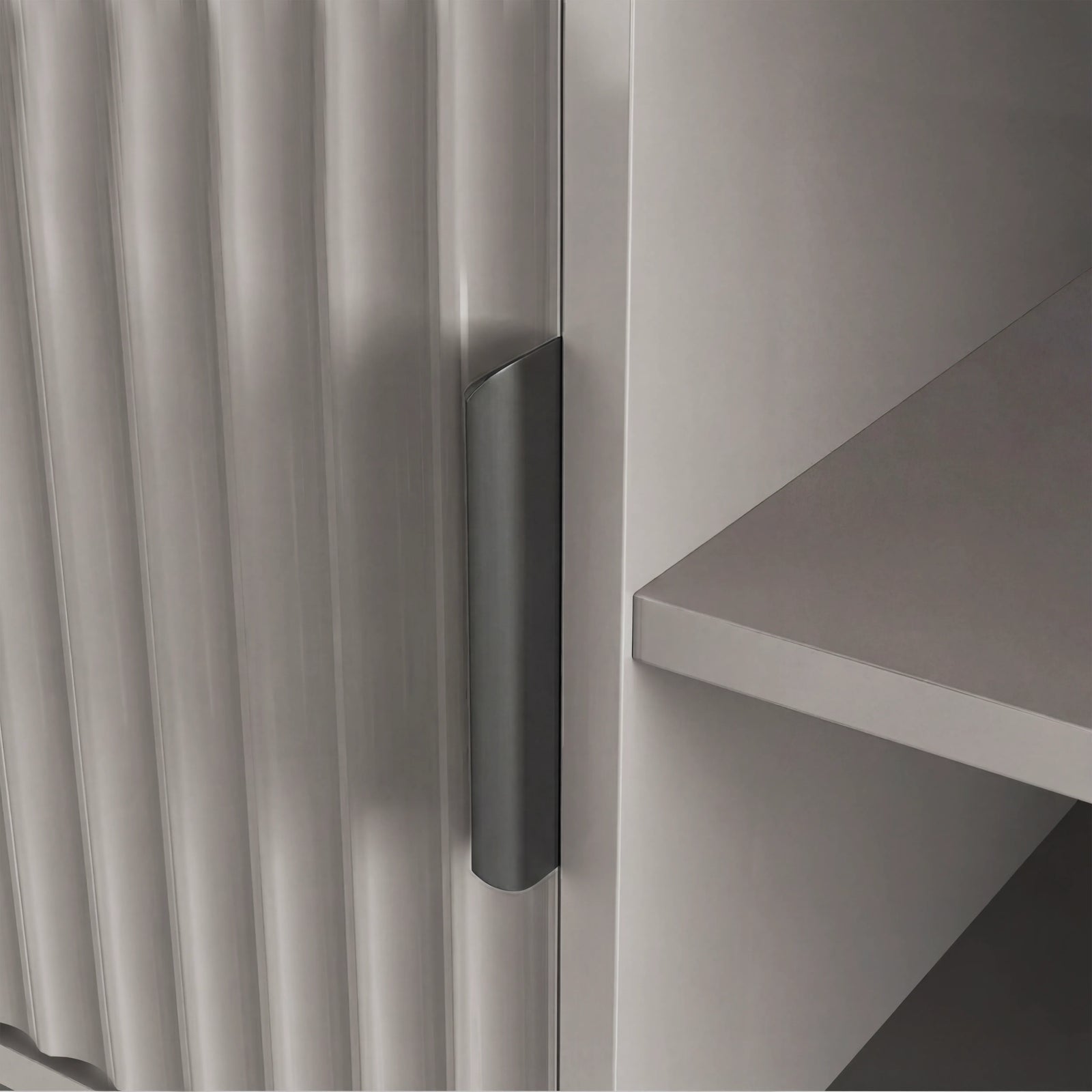 [Grey] Grey fluted door close-up with single dark handle, interior shelf edge visible to the right.