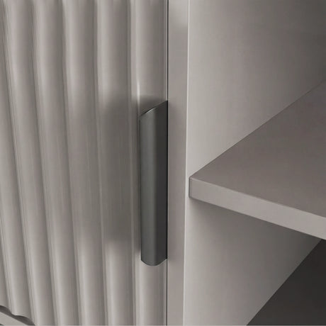 Grey modern TV stand with vertical fluted doors and grey handle, styled for a contemporary living room centerpiece.