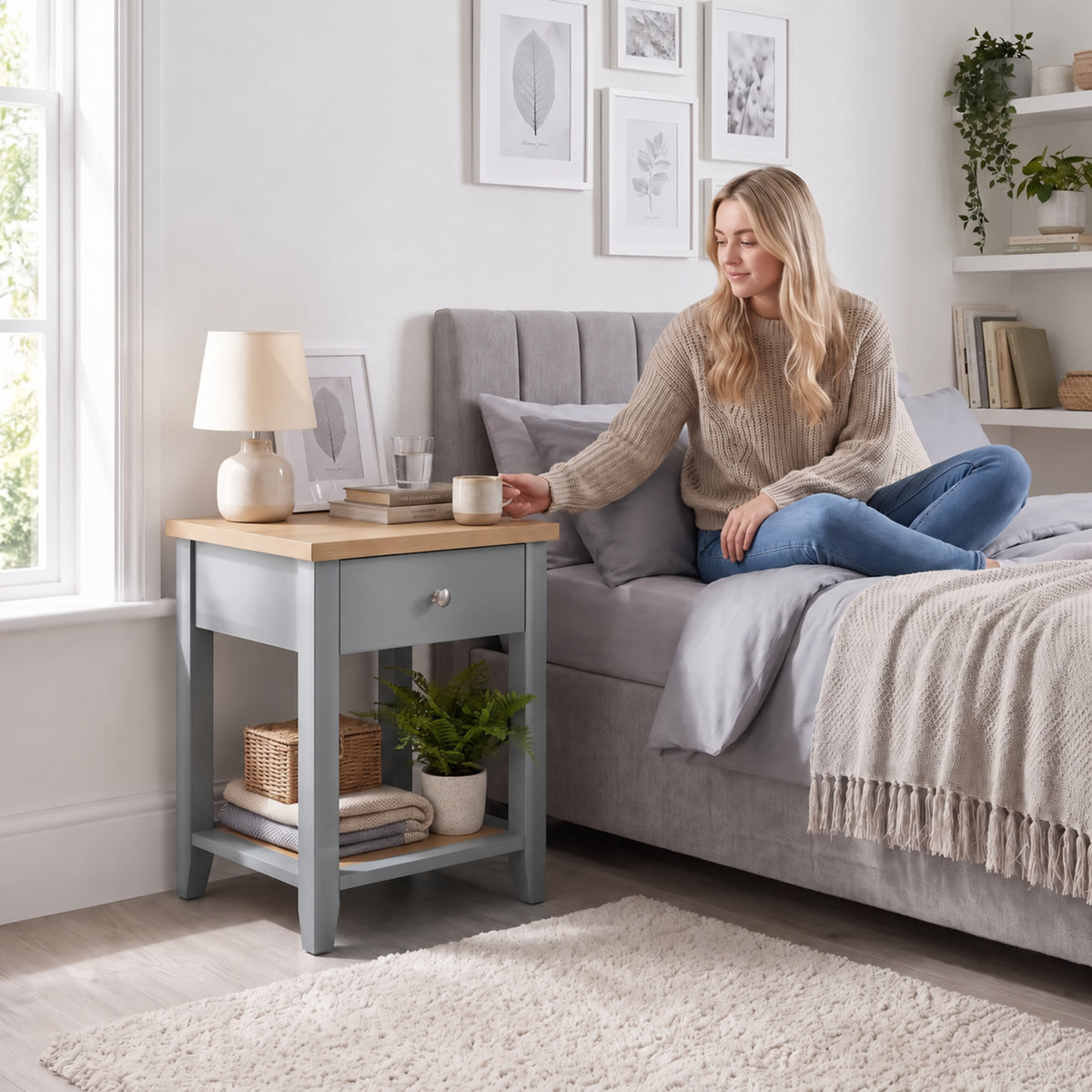 [Grey] Lifestyle view of Grey Shaker Bedside Table placed next to a modern upholstered bed.