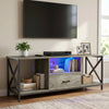 [Grey Oak] Calvera TV unit lifestyle below wall-mounted TV, motorbike model on warm-LED centre shelf, pampas in vase right