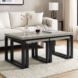 [Grey Oak] Nestline coffee table in a bright lounge with cream sofa, vase stems, and nested frames below