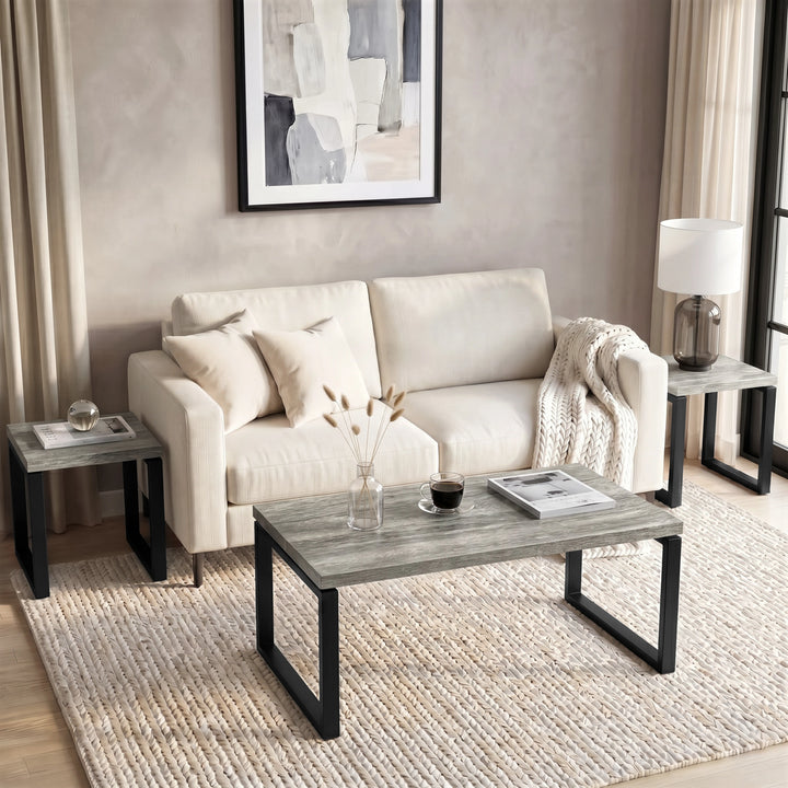 [Grey Oak] Nestline coffee table styled in a calm living room with beige chairs, framed art, and rug