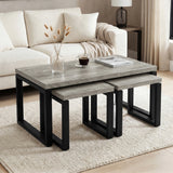 [Grey Oak] Nestline table set beside a cream sofa, with soft cushions, flowers, and black nesting frames