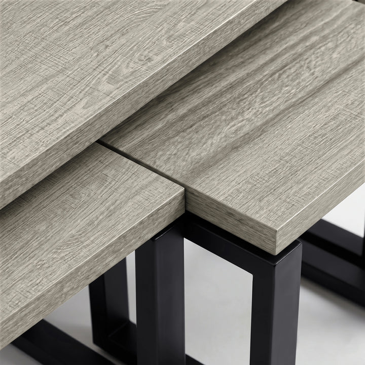 [Grey Oak] Nestline close-up of grey wood grain top meeting the square black metal support frame