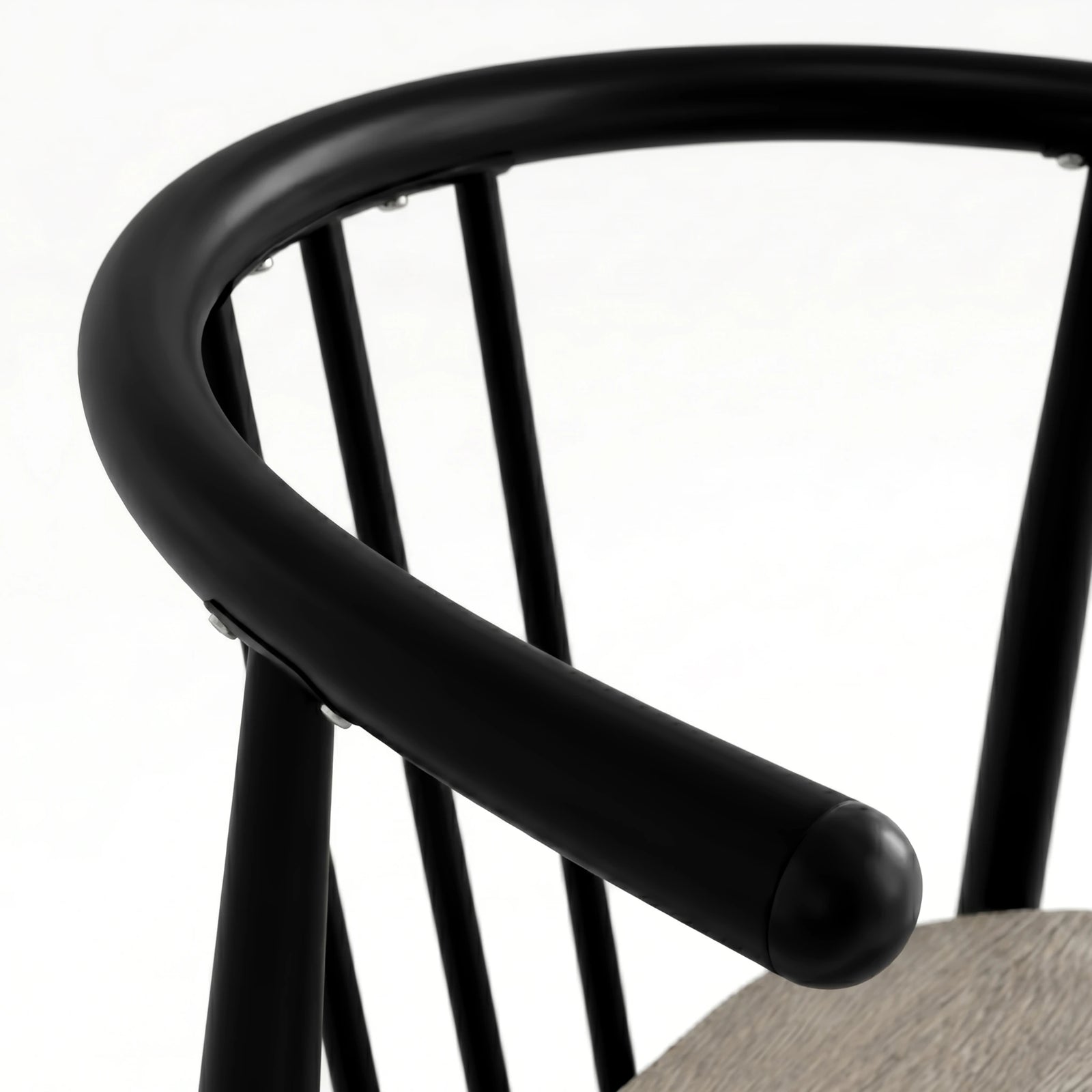 [Grey Oak] Torvi chair curved matte black metal backrest and armrest detail with rounded end cap close-up
