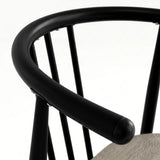 [Grey] Torvi chair curved matte black metal backrest and armrest detail with rounded end cap close-up