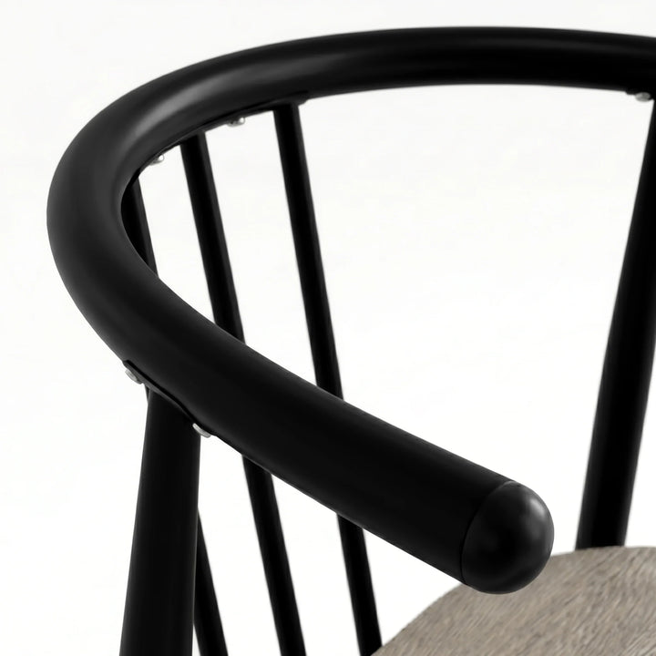 [Grey] Torvi chair curved matte black metal backrest and armrest detail with rounded end cap close-up