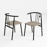 [Grey] Two Torvi dining chairs on white background showing black curved metal frame and grey oak wood seats